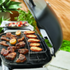 Rack for cooking above the grill of a Weber Q BBQ.